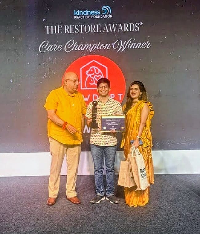 PawAdopt receiving the Care & Compassion Award at the Restore Awards